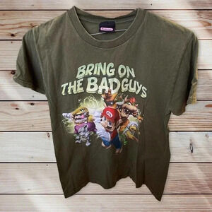 NINTENDO SIZE SMALL GREEN TEE WITH BRING ON THE BAD GUYS